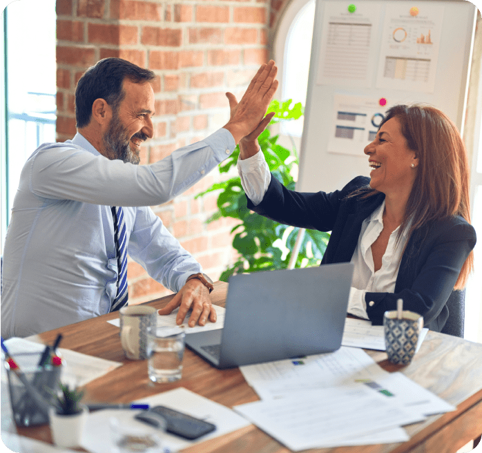 Two people giving each other a high five