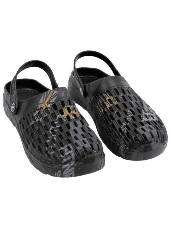 A pair of black shoes with gold designs on them.